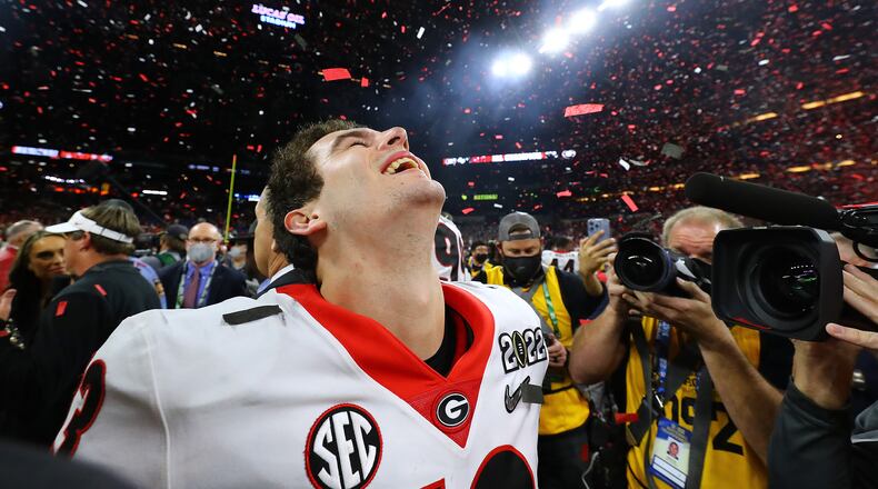 Stetson Bennett relishes the moment as the confetti flies, winning the College Football Playoff Championship game on Monday, Jan. 10, 2022, in Indianapolis. Curtis Compton/The Atlanta Journal-Constitution