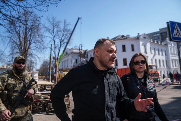 Ukrainian Interior Minister Ihor Klymenko visits the site of the Russian missile attack in Sumy, Ukraine, Monday, April 14, 2025. (AP Photo/Evgeniy Maloletka)