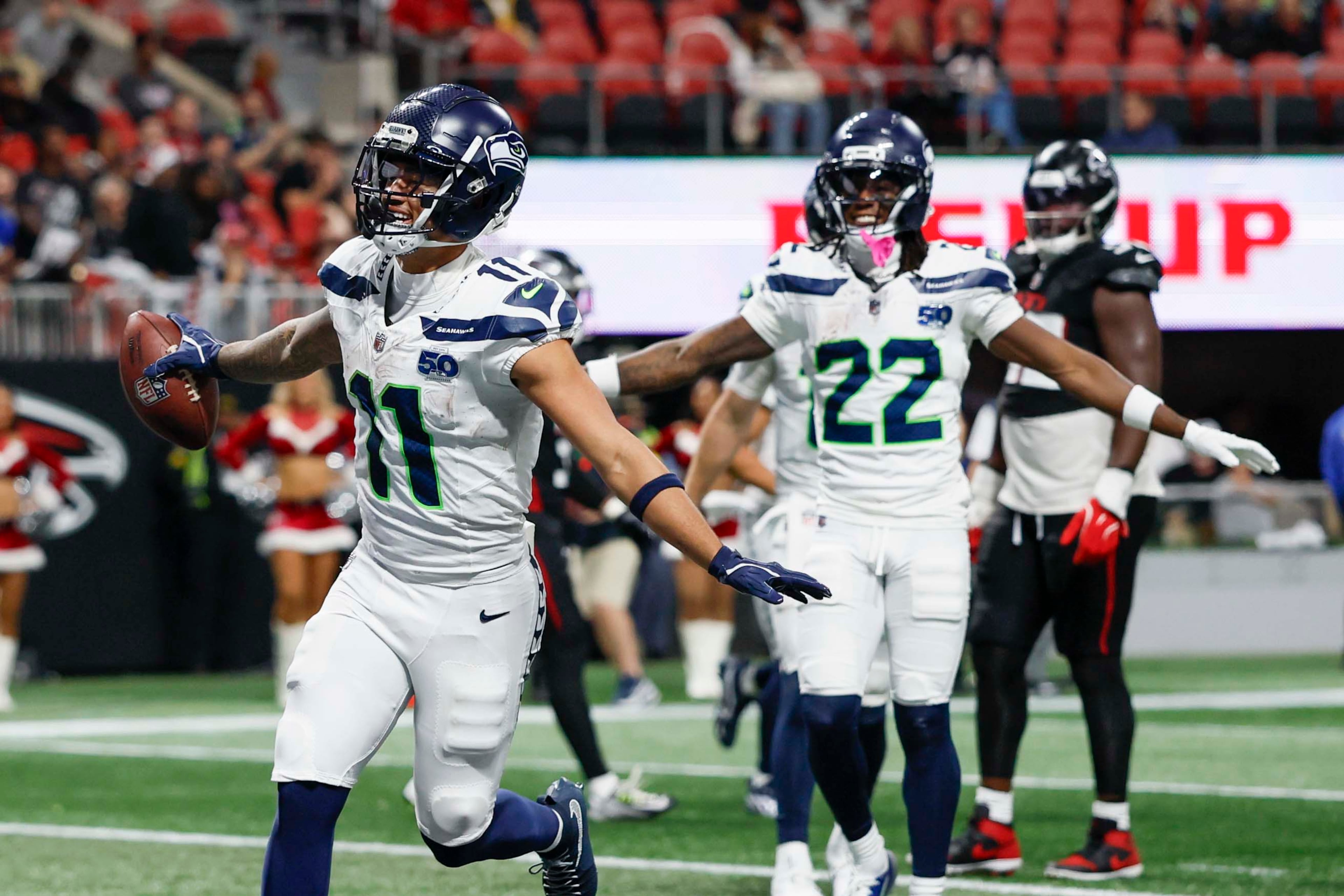 Seattle Seahawks wide receiver Jaxon Smith-Njigba (11) reacts after scoring a touchdown during the second half of an NFL game against the Atlanta Falcons at Mercedes-Benz Stadium in Atlanta on Sunday, Dec. 7, 2025.
(Miguel Martinez/ AJC)