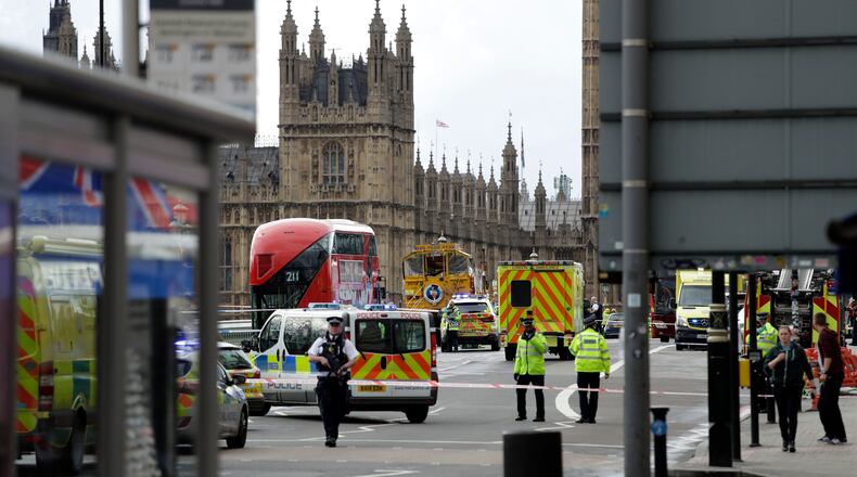 Police secure the area close to the Houses of Parliament in London, Wednesday, March 22, 2017. The leader of Britain's House of Commons says a man has been shot by police at Parliament. David Liddington also said there were "reports of further violent incidents in the vicinity." London's police said officers had been called to a firearms incident on Westminster Bridge, near the parliament. Britain's MI5 says it is too early to say if the incident is terror-related. (AP Photo/Matt Dunham)