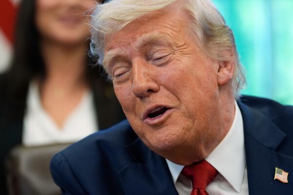 President Donald Trump speaks with reporters after signing executive orders in the Oval Office of the White House, Wednesday, April 23, 2025, in Washington. (AP Photo/Alex Brandon)