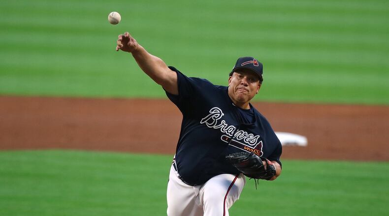 Bartolo Colon delivers a pitch in Friday’s exhibition against the Yankees in Atlanta. On Wednesday, he makes his Braves regular-season debut in New York when he faces the team for whom he played the past three seasons, the Mets. (Curtis Compton/AJC file photo)