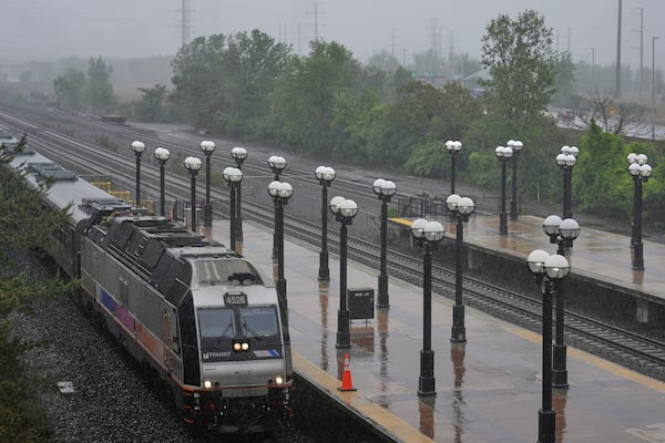 An NJ Transit train pulls into the Secaucus Junction station in Secaucus, N.J., Wednesday, May 14, 2025. (AP Photo/Seth Wenig)