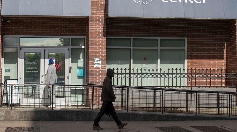 04/01/2020 - Atlanta, Georgia  - A man waits to be let into the Mercy Care Clinic at the Gateway Center in Atlanta, Wednesday, April 1, 2020. The Gateway Center is a homeless service center. (ALYSSA POINTER / ALYSSA.POINTER@AJC.COM)