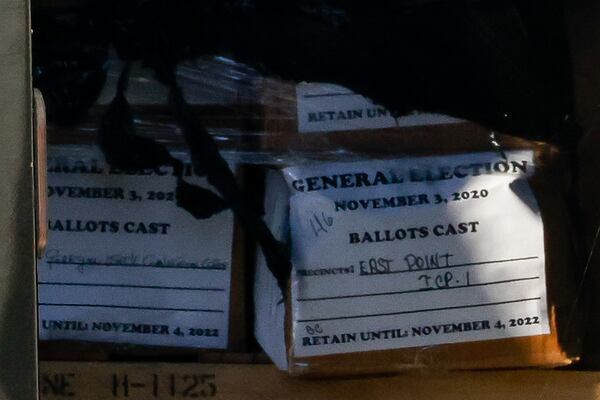 Boxes of 2020 ballots are carted out of Fulton County Election Hub and Operation Center in Union City on Wednesday, Jan. 28, 2026, as the FBI conducts a raid related to the 2020 election. (Arvin Temkar/AJC)