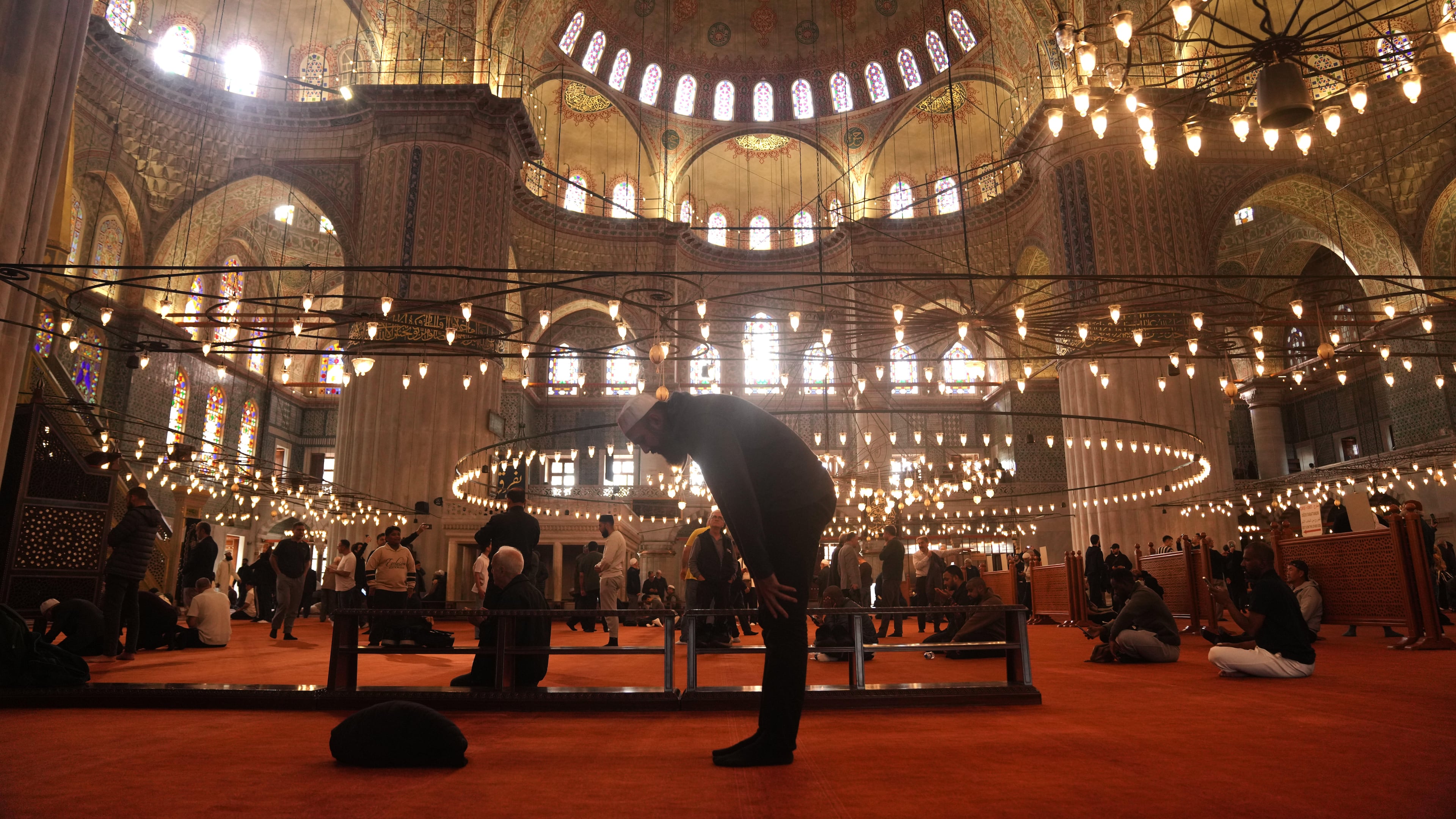 Muslims pray at the Ottoman-era Sultan Ahmed or Blue Mosque, in Istanbul, Turkey, Friday, Nov. 21, 2025, ahead of the visit of Pope Leo XIV to Turkey. (AP Photo/Francisco Seco)