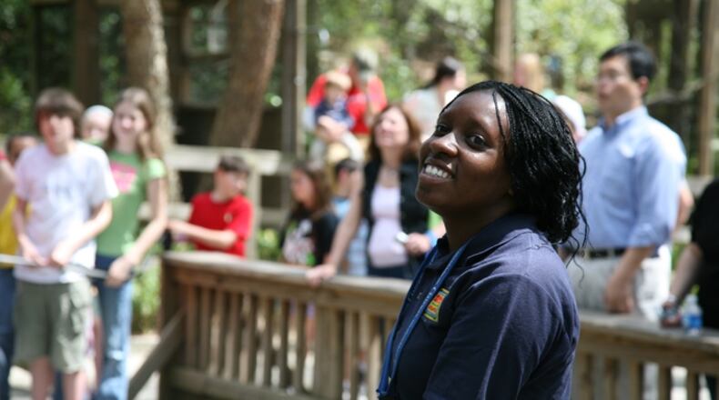 The job fair at Zoo Atlanta will give prospective employees an opportunity to apply for seasonal positions, including work as a rides attendant. Here, a zoo worker helps children at the Safari Slide and rock-climbing wall. Photo: courtesy Zoo Atlanta