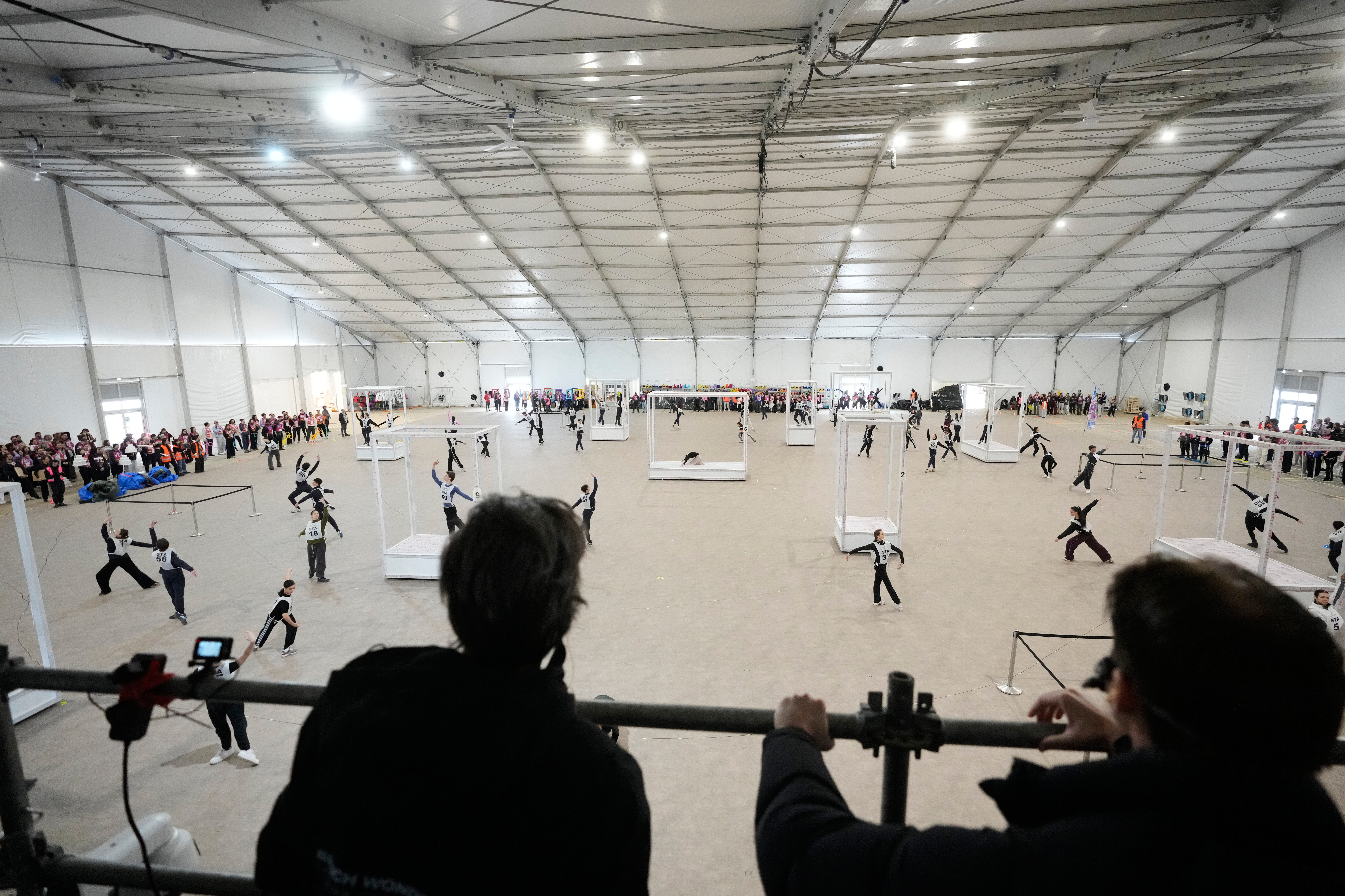 Volunteer dancers perform during rehearsals for the opening ceremony of the Milan Cortina 2026 Winter Olympic Games, at a compound in a big tent next to San Siro Stadium, in Milan, Italy, Saturday, Jan. 24, 2026. (AP Photo/Luca Bruno)