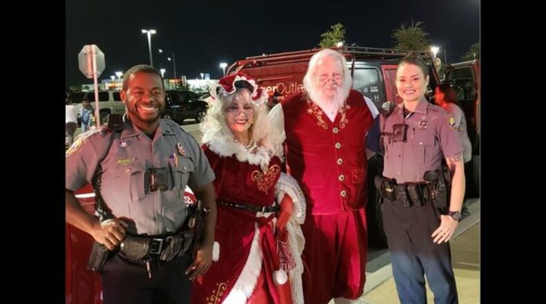 Two Daytona Beach police officers busted a theft ring while escorting Santa. (Photo: Daytona Beach Police)