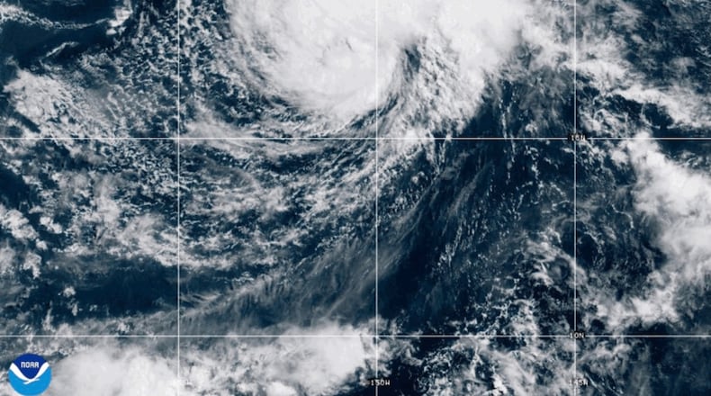 This NOAA satellite image taken at 5:22 p.m. EST on Friday, Aug. 14, 2026, shows Tropical Storm Lala as it approaches Hawaii's Big Island. (NOAA via AP)
