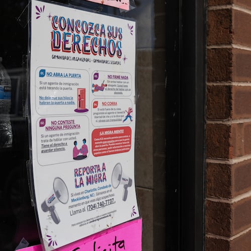 A sign in Spanish that reads at top: "Know Your Rights" is displayed outside of a restaurant store front, Thursday, Nov. 13, 2025, in Charlotte, N.C. (AP Photo/Matt Kelley)