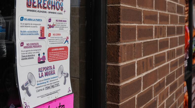 A sign in Spanish that reads at top: "Know Your Rights" is displayed outside of a restaurant store front, Thursday, Nov. 13, 2025, in Charlotte, N.C. (AP Photo/Matt Kelley)
