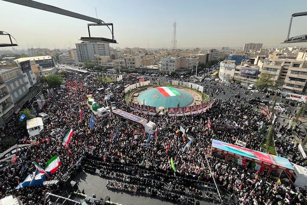 Mourners gather in Islamic Revolution Square (Enghelab Square) to attend the funeral ceremony of the Iranian army generals, nuclear scientists and their family members who were killed in Israeli strikes, during a funeral ceremony in Tehran. Iran, Saturday, June 28, 2025. (AP Photo/Vahid Salemi)