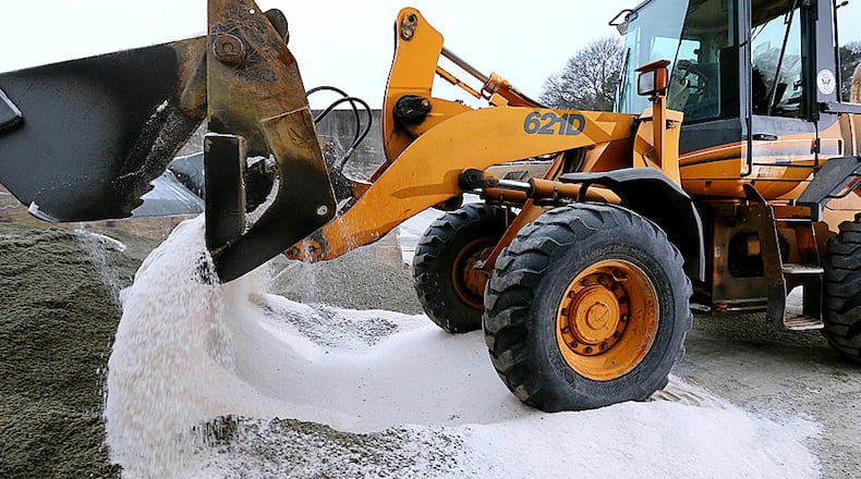 021014 ATLANTA: A loader mixes salt with rock while the first city trucks are loaded to prepare roads for approaching winter weather at the Public Works North Avenue Facility on Monday, Feb. 10, 2014, in Atlanta. CURTIS COMPTON / CCOMPTON@AJC.COM