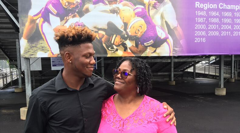 Georgia Tech freshman quarterback James Graham with his mother Bridget Daniels at the Fitzgerald High School football stadium. (AJC photo by Ken Sugiura)