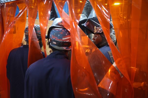 Tulsa Welding School students, including Tyrell Willoughby (right), work in the welding lab on the campus in Decatur on Aug. 13, 2026. (Arvin Temkar/AJC)