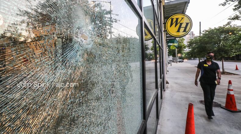 Bullets hit the front of the Waffle House on Courtland Street and injured an innocent bystander, according to a spokeswoman for the restaurant.