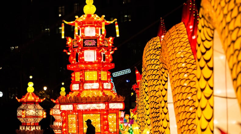 A man is silhouetted against the Chinese Palace lantern at the Chinese Lantern Festival in Centennial Olympic Park, Friday, Dec. 9, 2016, in Atlanta. Branden Camp/Special