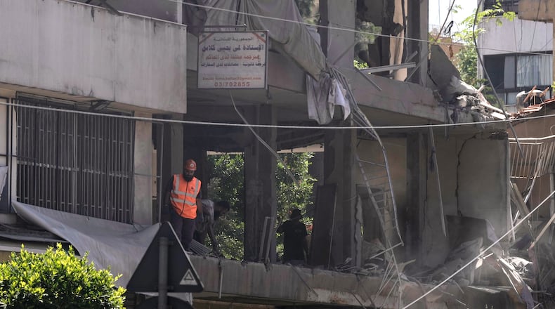 A rescue worker checks an apartment that was hit in an Israeli airstrike in Dahiyeh, Beirut's southern suburbs, Lebanon, Sunday, June 14, 2026. (AP Photo/Bilal Hussein)