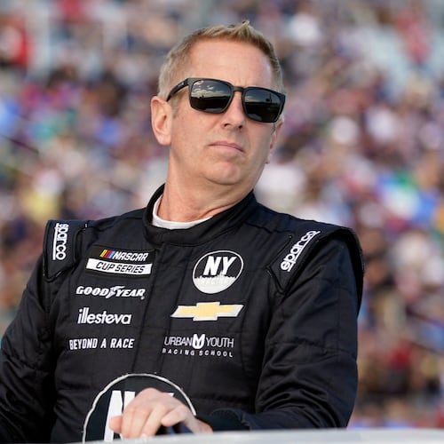 FILE - Greg Biffle looks on during driver introductions before the NASCAR Daytona 500 auto race at Daytona International Speedway, in Daytona Beach, Fla., Feb. 20, 2022. (AP Photo/John Raoux, File)