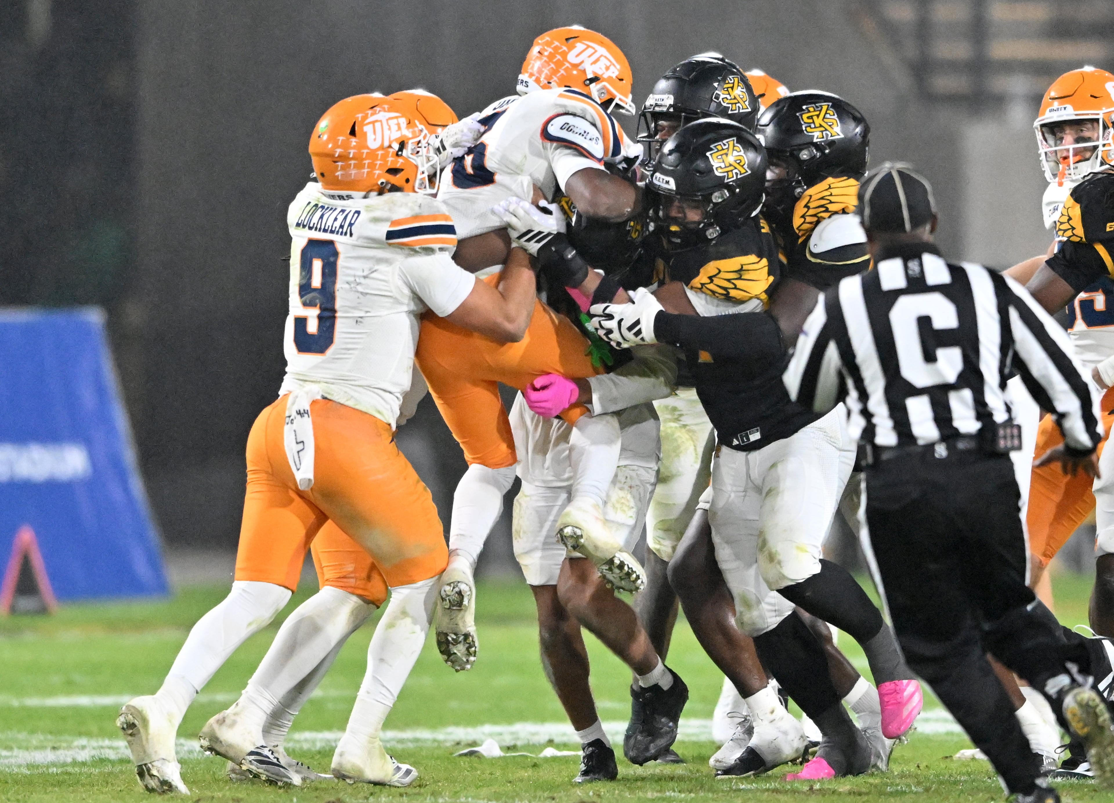 UTEP wide receiver Kenny Odom (6) is lifted up by Kennesaw State defense players during the second half in an NCAA college football game at Fifth Third Stadium, Tuesday, October 28, 2025 in Kennesaw. Kennesaw State won 33-20 over University of Texas at El Paso. (Hyosub Shin / AJC)