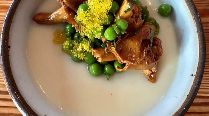 8Arm’s chawanmushi (steamed egg custard) is chilled and topped with house-cured ham, English peas, chanterelles and yuzu tobiko (flying fish roe). (Wendell Brock for The Atlanta Journal-Constitution)