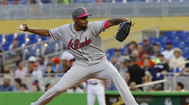 Julio Teheran of the Braves throws against the Miami Marlins Saturday night. The Braves wore pink uniforms to celebrate Mother’s Day weekend. (Photo by Joe Skipper/Getty Images)