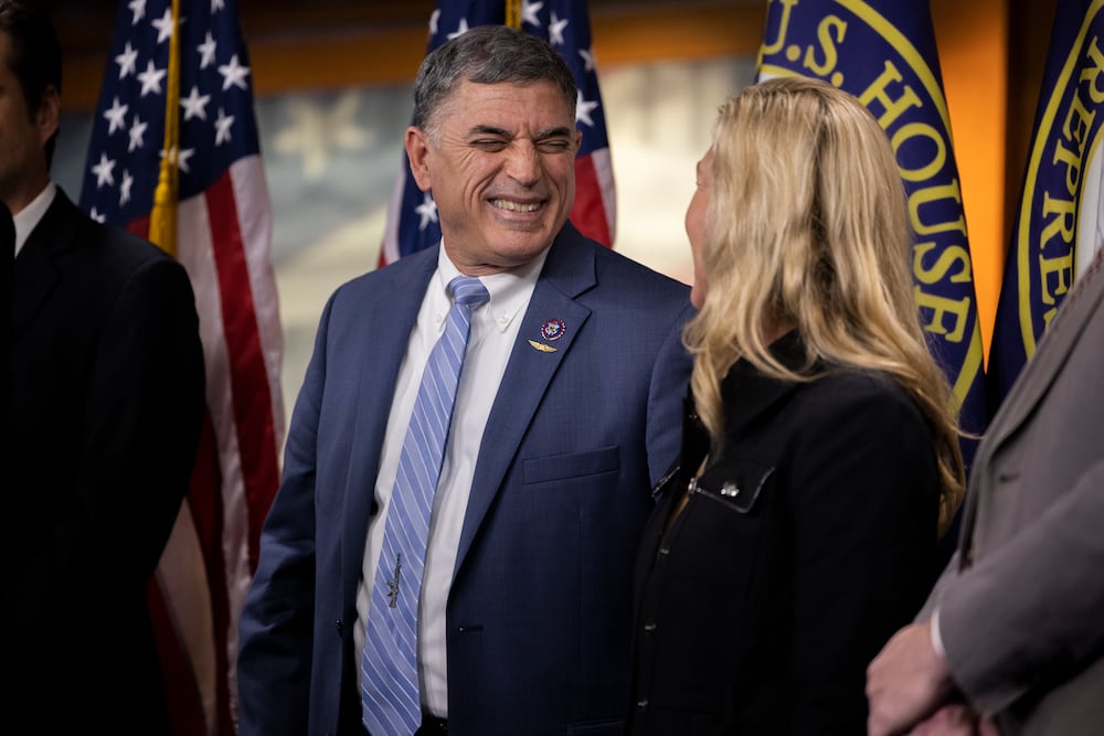 U.S. Reps. Andrew Clyde (left), R-Athens, and Marjorie Taylor Greene, R-Rome, took a stance against cryptocurrency legislation and a defense spending bill on Tuesday.