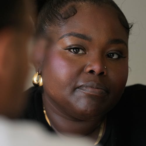 Oakland Ceasefire-Lifeline life coach LaSasha Long, right, talks to Bernard C. during an interview Thursday, April 23, 2026, in Oakland, Calif. (AP Photo/Jeff Chiu)