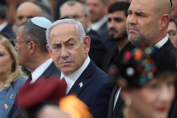 Israeli Prime Minister Benjamin Netanyahu, center, Speaker of the Israeli Knesset, Amir Ohana, right, and Jerusalem mayor Moshe Leon, left, attend the annual ceremony at the eve of Israel's Remembrance Day for fallen soldiers at the Yad LaBanim Memorial in Jerusalem, on Tuesday, April 29, 2025. (Abir Sultan/Pool Photo via AP)