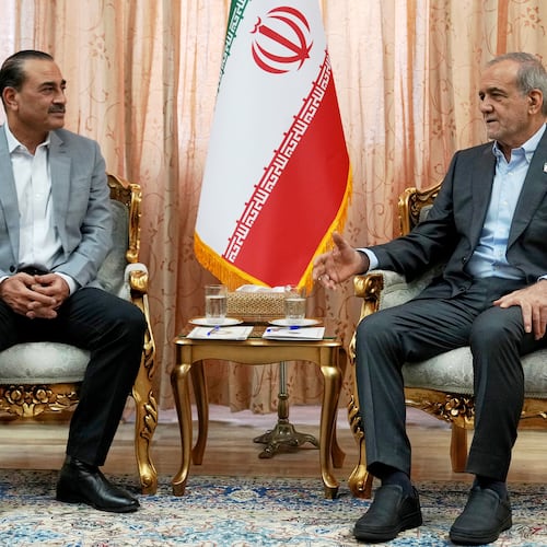 In this photo released by the Iranian Presidency Office, President Masoud Pezeshkian, right, speaks with Pakistan's Army Chief Field Marshal Gen. Asim Munir in Tehran, Iran, Saturday, May 23, 2026. (Iranian Presidency Office via AP)