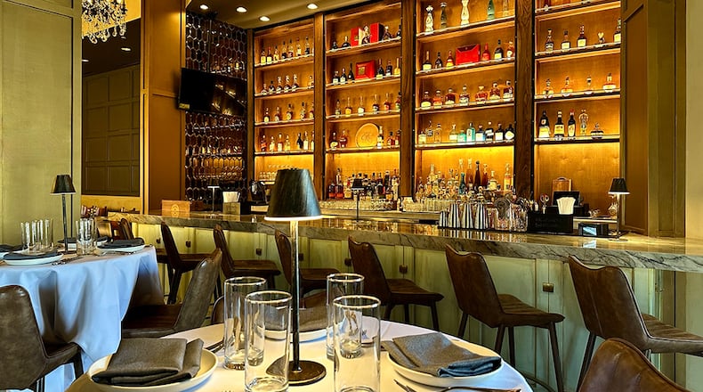 A double-height bar greets diners upon entering Pêche Modern Coastal in Peachtree Corners. Courtesy of Pêche Modern Coastal