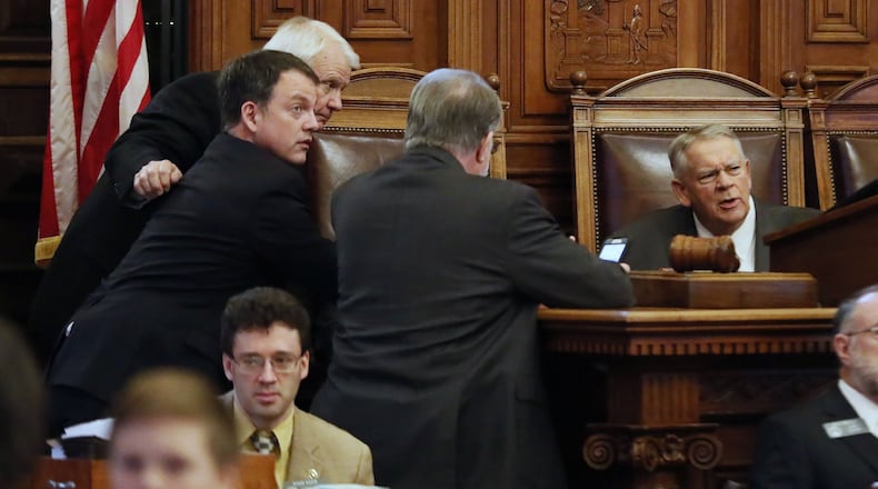 State House Majority Leader Jon Burns, from left, House Minority Leader Robert Trammell, Appropriations Chairman Terry England and House Speaker David Ralston confer during this year’s legislative session. Bob Andres / bandres@ajc.com