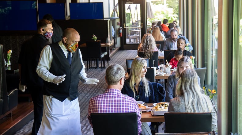 Ray's on the River employees wait on customers at the Sandy Springs location on May 10, 2020. STEVE SCHAEFER / SPECIAL TO THE AJC