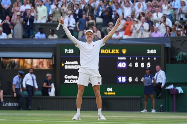 Jannik Sinner of Italy celebrates after winning the men's singles final match against Carlos Alcaraz of Spain at the Wimbledon Tennis Championships in London, Sunday, July 13, 2025.(AP Photo/Kirsty Wigglesworth)