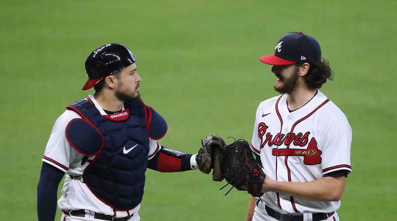 Braves catcher Travis d’Arnaud gives starting pitcher Ian Anderson a glove bump against the Miami Marlins in Game 2 of a National League Division Series at Minute Maid Park on Wednesday, Oct 7, 2020 in Houston. Anderson went 5 2/3 innings in a 2-0 victory over the Marlins for a 2 game to none lead in the series. “Curtis Compton / Curtis.Compton@ajc.com”