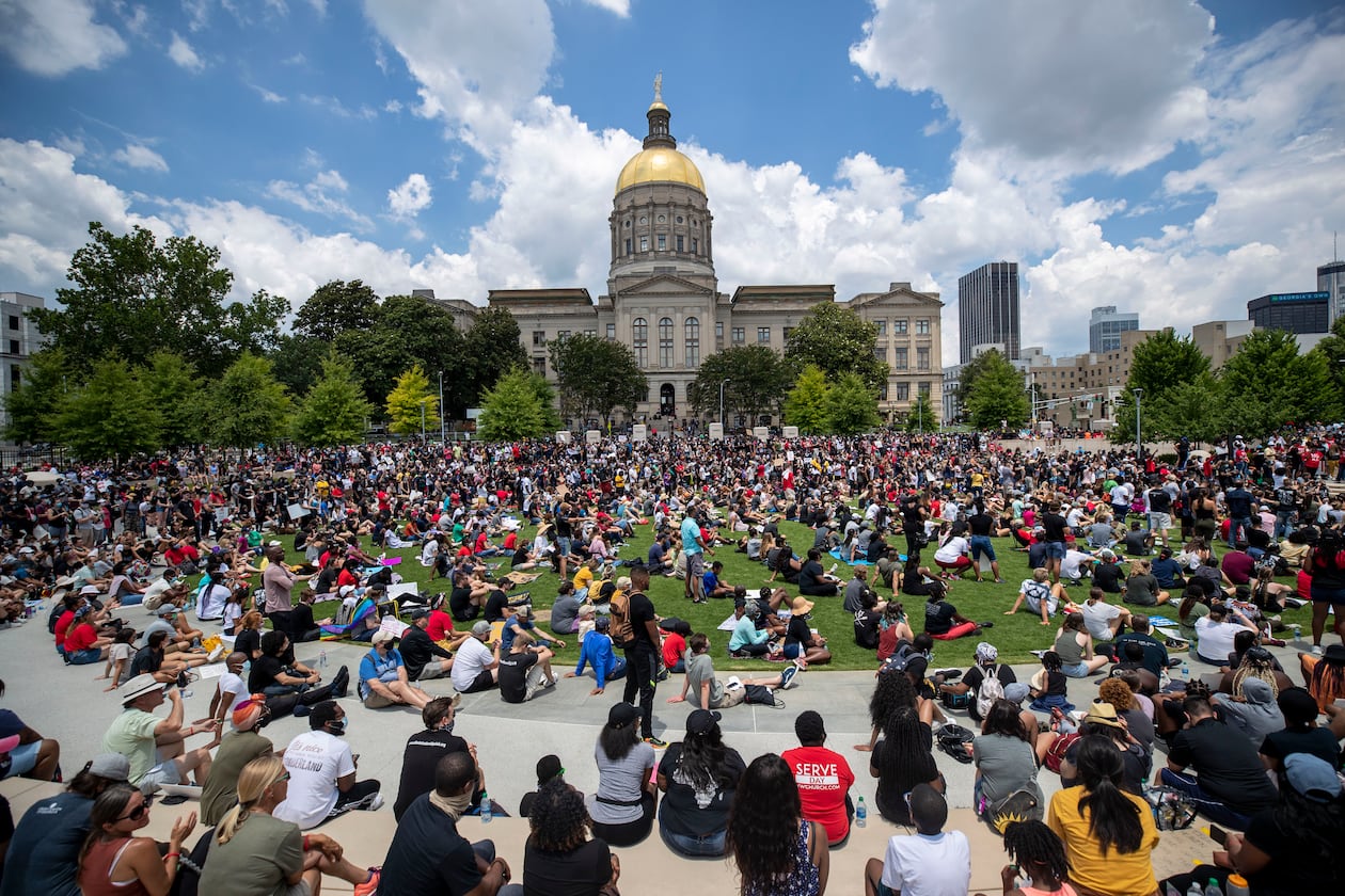 06/19/2020 - Atlanta, Georgia - Hundreds of participants of the "OneRace Movement" listen to leaders inside Liberty Plaza, across the street form the Georgia State Capitol building in Atlanta, Friday, June 19, 2020. The group marched from Centennial Olympic Park to the State Capitol building. (ALYSSA POINTER / ALYSSA.POINTER@AJC.COM)