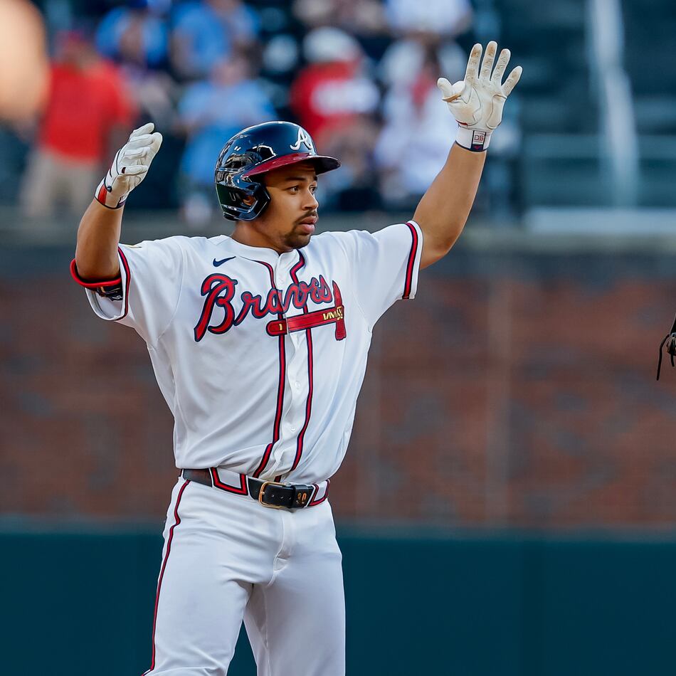 Braves designated hitter Drake Baldwin (left) celebrates after hitting a double as San Francisco Giants first baseman Bryce Eldridge stands by on Monday, Aug. 31, 2026, in Atlanta. The numbers overwhelmingly favor the Braves to make the playoffs. (Erik S. Lesser/AP)