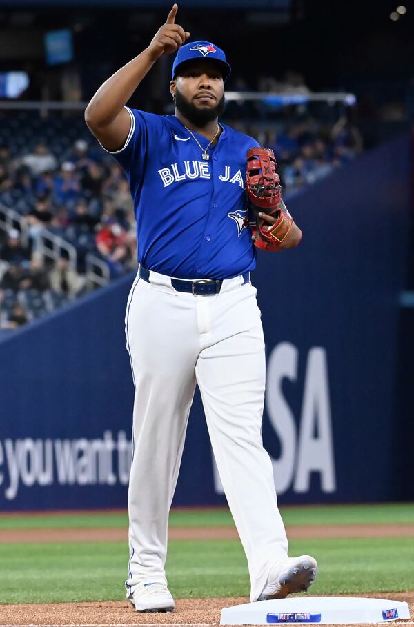 Toronto Blue Jays first baseman Vladimir Guerrero Jr. gestures to the crowd before a baseball game against the Atlanta Braves in Toronto, Monday, April 14, 2025. (Jon Blacker/The Canadian Press via AP)