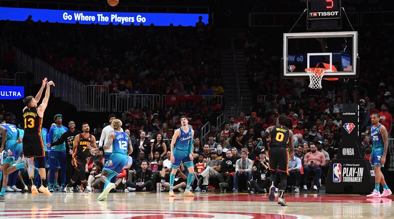 Hawks' guard Bogdan Bogdanovic (13) shoots a 3-point basket during the second half in the NBA play-in tournament at State Farm Arena on Wednesday, April 13, 2022.  (Hyosub Shin / Hyosub.Shin@ajc.com)