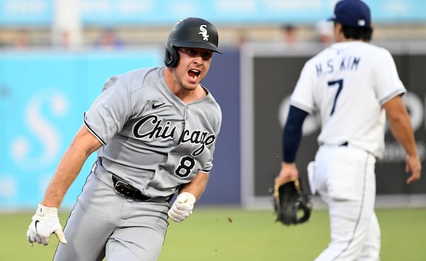 Chicago White Sox catcher Kyle Teel (8) runs to third base on a single by teammate Colson Montgomery during the second inning of a baseball game against the Tampa Bay Rays Monday, July 21, 2025, in Tampa, Fla. (AP Photo/Jason Behnken)