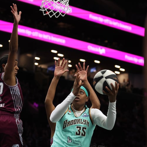 New York Liberty center Jonquel Jones (35) goes up for a shot against Toronto Tempo guard Brittney Sykes (20) during the first half of a WNBA basketball game, Wednesday, June 3, 2026, in New York. (AP Photo/Heather Khalifa)