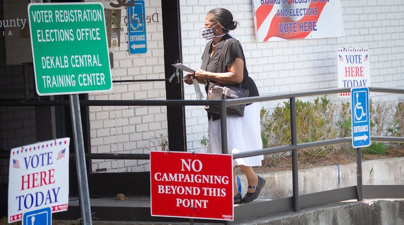 A woman walks into the Dekalb County Voter Registration & Elections Office to vote in Decatur Saturday, May 30, 2020. STEVE SCHAEFER FOR THE ATLANTA JOURNAL-CONSTITUTION