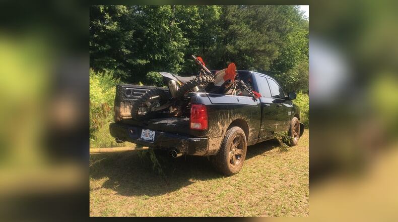 Coweta County deputies are searching for at least two people who broke into several cars in a Newnan neighborhood early Friday, stole a pickup truck and fired at a homeowner before leading police on a chase.