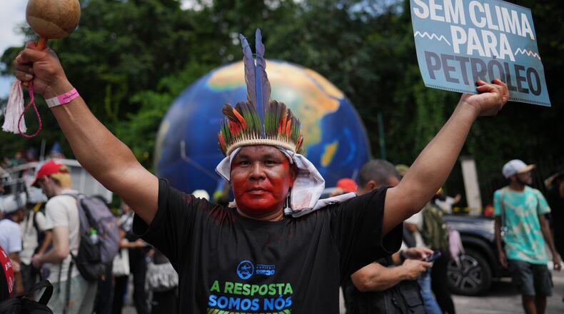Indigenous activists participate in a climate protest during the COP30 U.N. Climate Summit, Monday, Nov. 17, 2025, in Belem, Brazil. (AP Photo/Andre Penner)