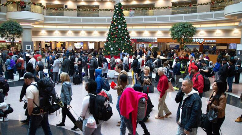 <p>Travelers wait in long lines to get to the security checkpoint at <span class="wsc-spelling-problem" data-spelling-word="Hartsfield-Jackson" data-wsc-lang="en_US">Hartsfield-Jackson</span> International Airport on Sunday on what is expected to set a record travel day. (Photo: STEVE SCHAEFER / SPECIAL TO THE <span class="wsc-spelling-problem" data-spelling-word="AJC" data-wsc-lang="en_US">AJC</span>)</p>
