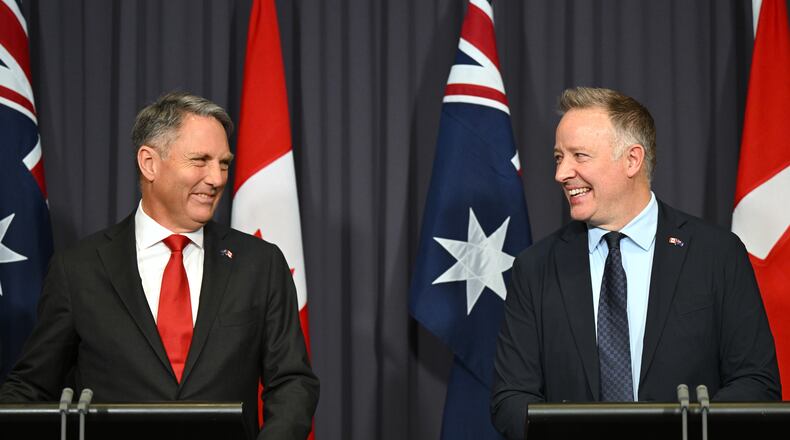 Australian Defense Minister Richard Marles, left, and Canada's Secretary of State Stephen Fuhr speak to the media after signing an agreement on export of an Over-the-Horizon Radar system at Parliament House in Canberra, Australia, Monday, June 22, 2026. (Lukas Coch/AAP Image via AP)