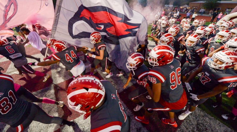 The Hillgrove Harks take the field during their home game against the McEachern Indians Friday, October 5, 2018 at Hillgrove High School.