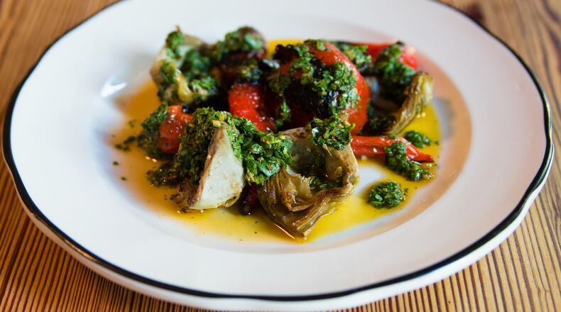 Cakes + Ale pairs artichokes with nardellos, a sweet Italian pepper, as well as roasted tomato and green harrissa. CONTRIBUTED BY HENRI HOLLIS