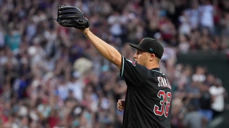 Arizona Diamondbacks pitcher Paul Sewald (38) celebrates after defeating the Atlanta Braves during a baseball game, Saturday, April 4, 2026, in Phoenix. (AP Photo/Rick Scuteri)